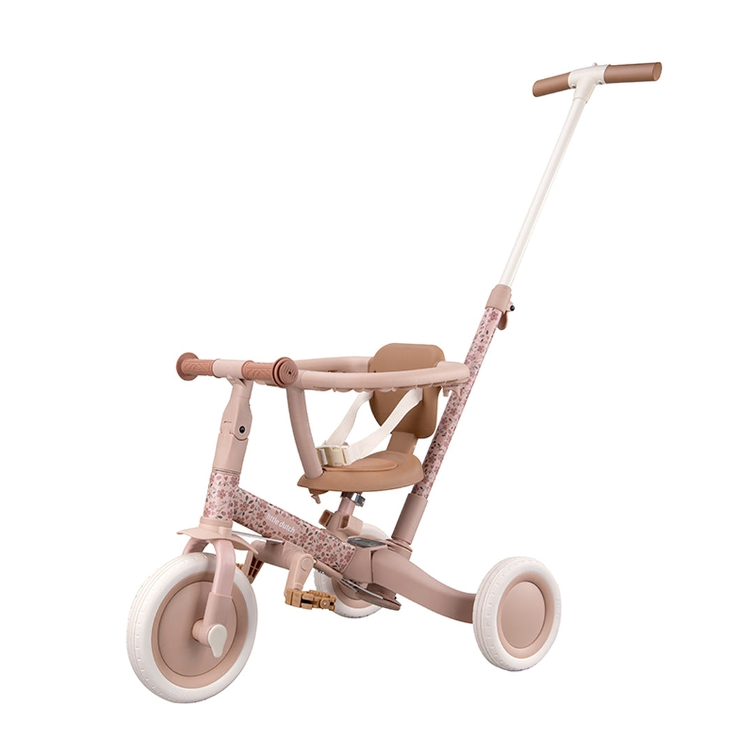Mitwachsendes 4-in-1 Dreirad Fairy Floral Rosa mit Schubstange, Sicherheitsring und verstellbarem Sitz. Hochwertiges Kinderdreirad für Kinder ab 1 Jahr, das sich vom Schiebedreirad zum Laufrad umbauen lässt und spielerisch Balance sowie Koordination fördert.c